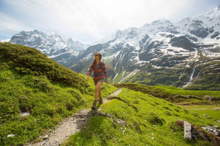 A woman on a trail in the Alps.