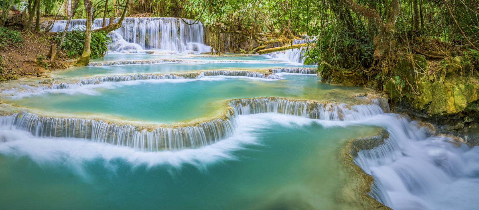 Beautiful blue green color of water at Kuang Si Falls.