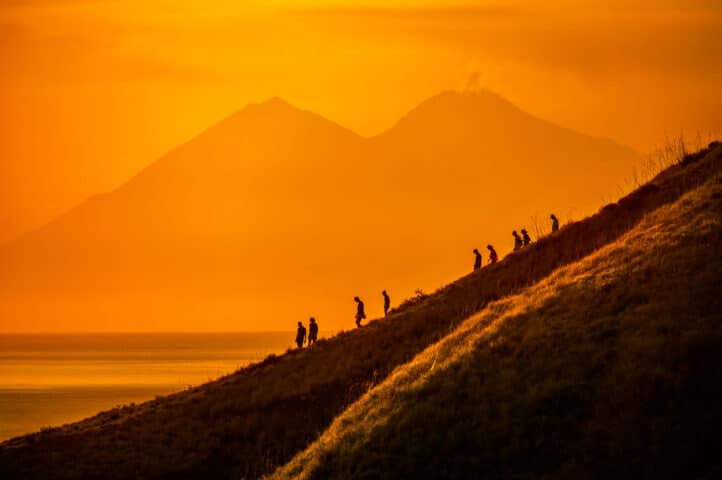 A group of people hiking Komodo Island.