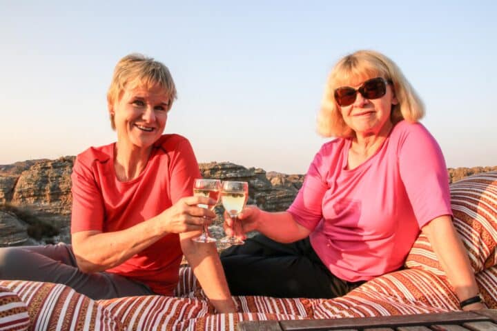 Two women enjoying a glass of wine in Madagascar.