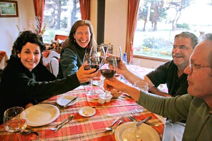A family enjoying a glass of wine together.