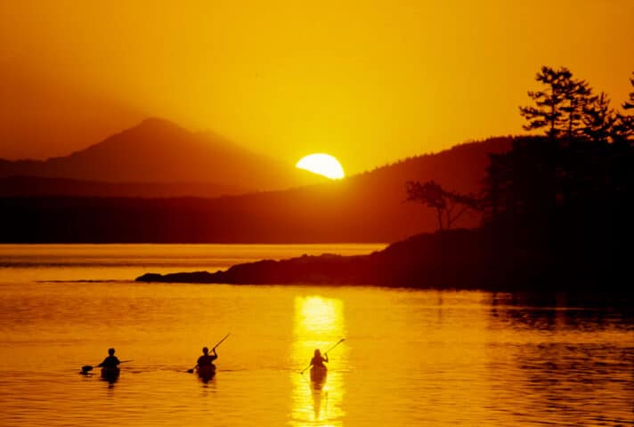 Sea kayakers at sunset.